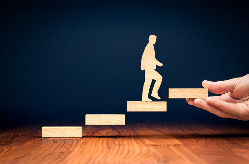 Man ascending wooden steps symbolically